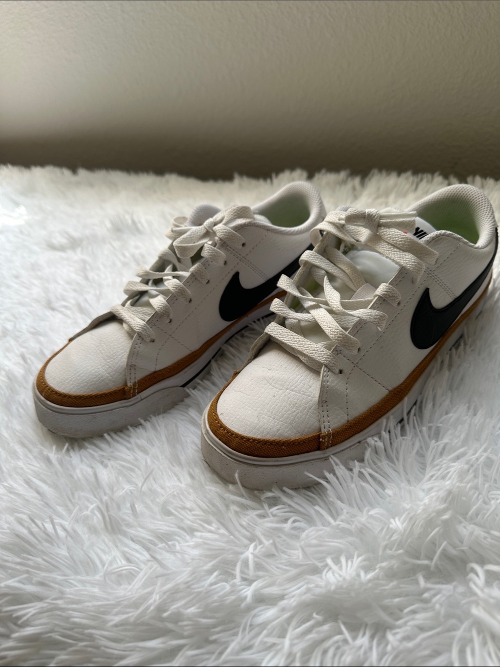 Nike Kids Cream Sneakers with Black Swoosh and Brown Trim